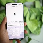 a person holding a cell phone in their hand